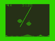 Defense for Dragon 32/64 - The screen flashes when your base is  hit (default colors).
