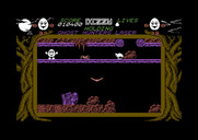 Dizzy: The Ultimate Cartoon Adventure for Commodore 64 - A spider blocks the path on this platform.