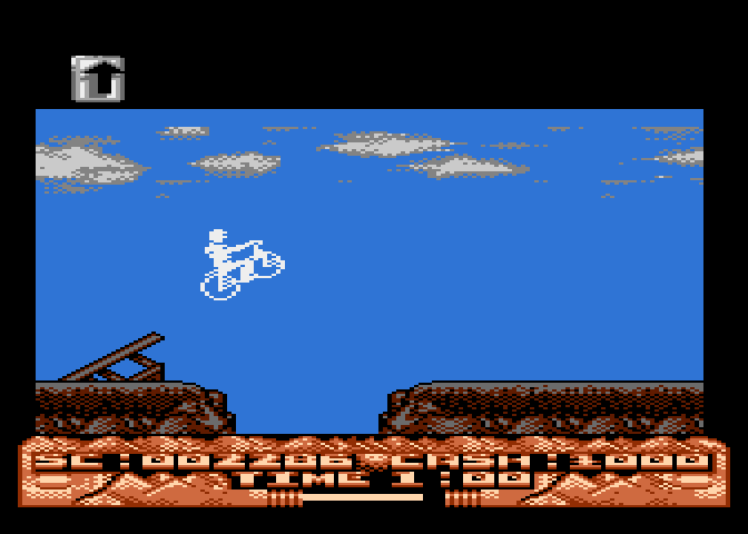 Mountain Bike Racer Atari 8-bit Screenshot: Use ramps to jump over these large gaps.