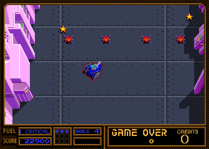 Vindicators Part II Arcade Screenshot: Don't run over these mines.