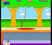 Pitfall II: Lost Caverns for Arcade - Swinging across a lava pit.