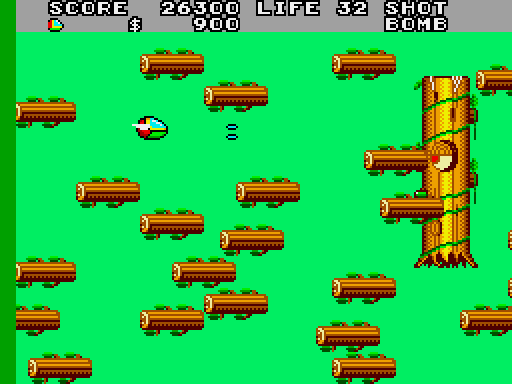 Fantasy Zone II: The Tears of Opa-Opa Arcade Screenshot: Fighting a tree creature.