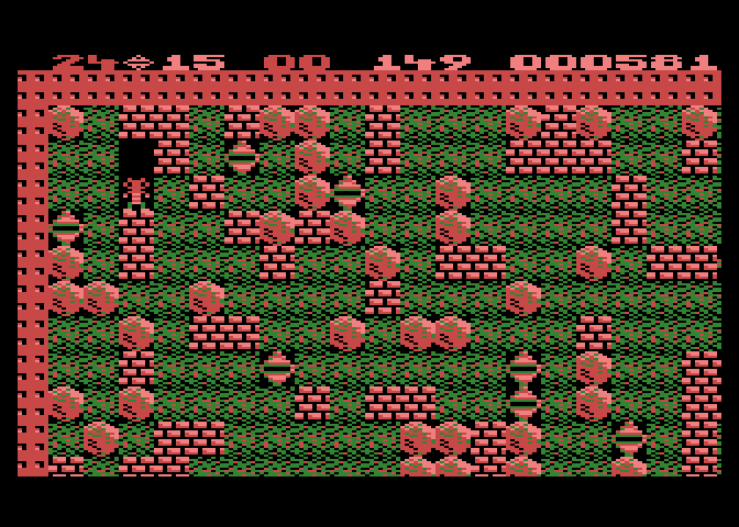Boulder Dash Atari 8-bit Screenshot: Lots of boulders create a hazard in this cave.
