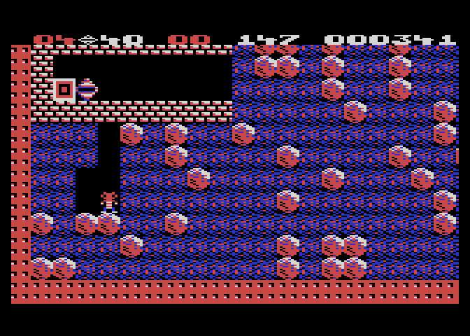 Boulder Dash Atari 8-bit Screenshot: More of those deadly boxes guard the diamonds...