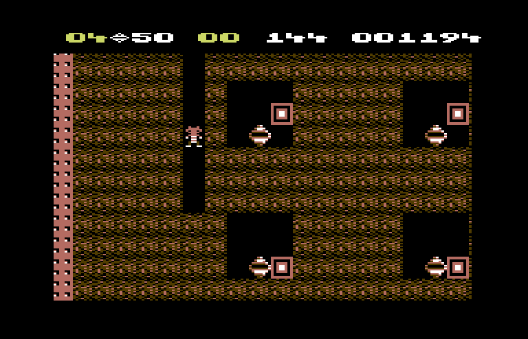 Boulder Dash Commodore 64 Screenshot: The diamonds in this cave are guarded...