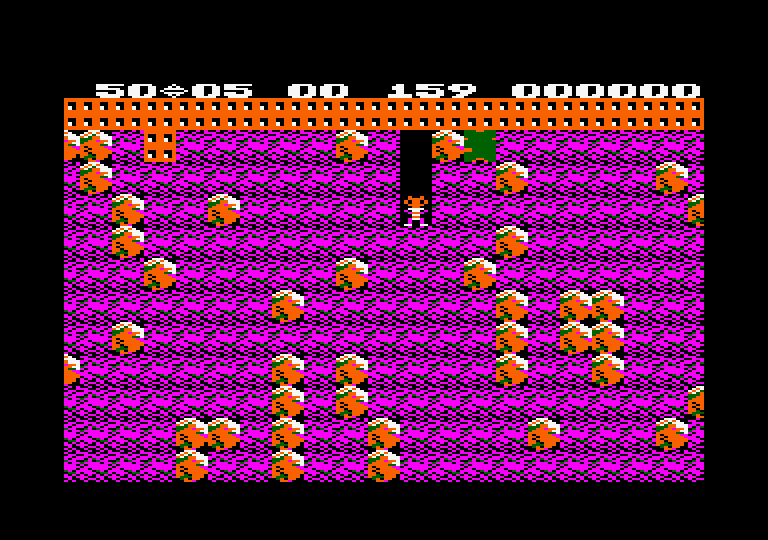 Boulder Dash Amstrad CPC Screenshot: That green block of ameoba will eventually start to grow...