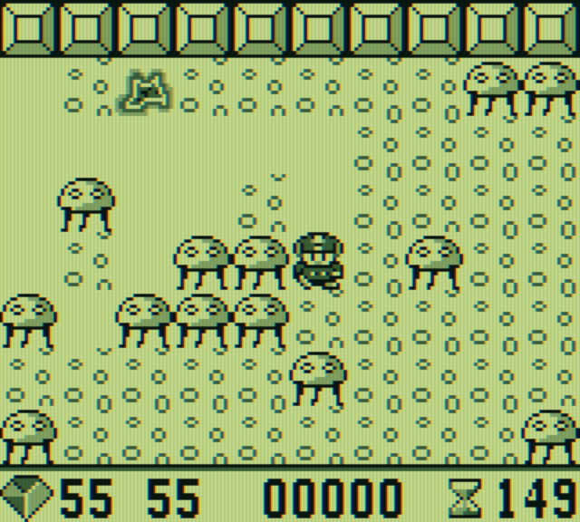 Boulder Dash Game Boy Screenshot: Slime will slowly grow on this level...