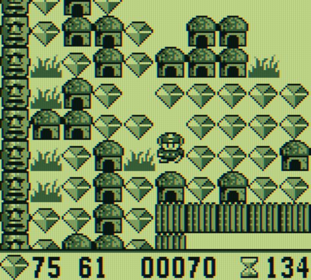 Boulder Dash Game Boy Screenshot: Picking up some diamonds...
