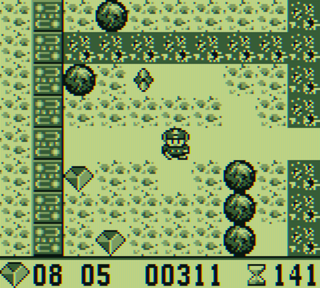 Boulder Dash Game Boy Screenshot: Watch out for the creature above you, it's dangerous!