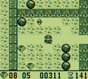 Boulder Dash for Game Boy - Watch out for the creature above you, it's dangerous!