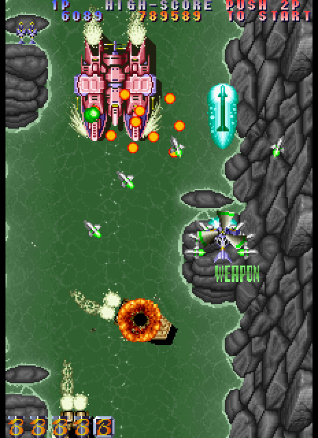 Twin Cobra II Arcade Screenshot: The next river assault begins...