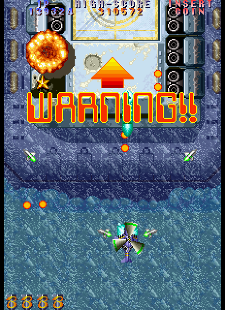 Twin Cobra II Arcade Screenshot: Warning! Large enemy approaching...