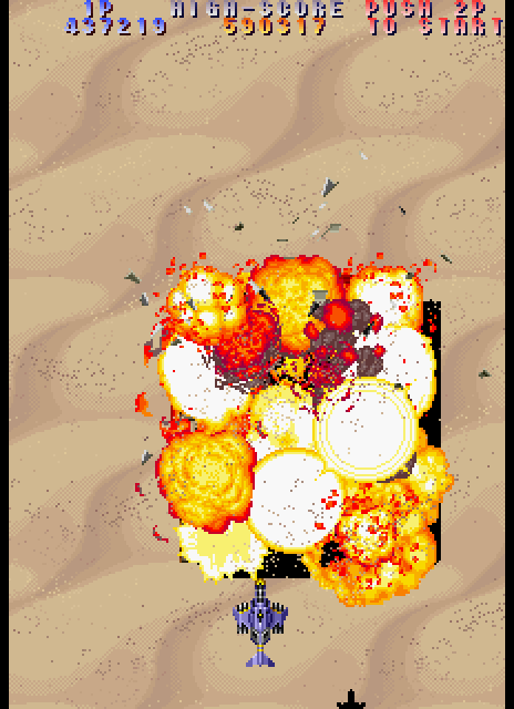 Twin Cobra II Arcade Screenshot: Tank destroyed!
