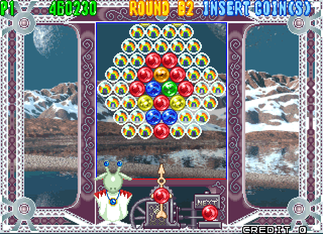 Bust-A-Move 4 Arcade Screenshot: Things get trickier with all of these rainbow bubbles...