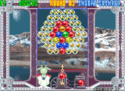 Bust-A-Move 4 for Arcade - Things get trickier with all of these rainbow bubbles...