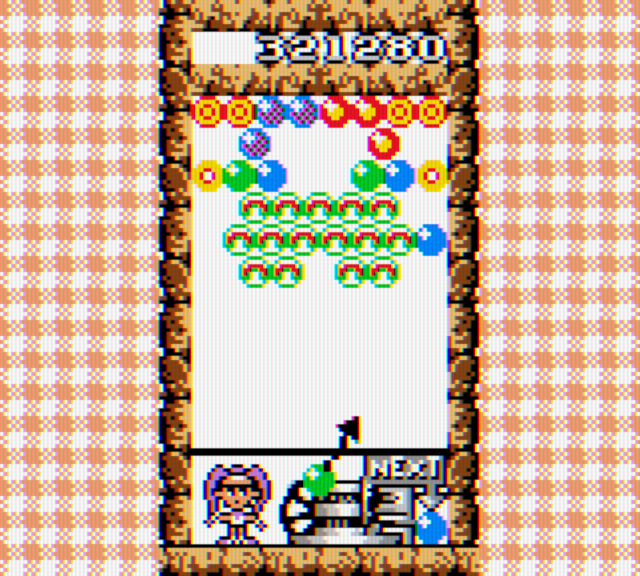 Bust-A-Move 4 Game Boy Color Screenshot: Shooting bubbles into place on the second round...