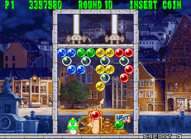 Bust-A-Move Again Arcade Screenshot: Puzzle pieces are pushed down...don't let them hit the bottom!