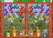 Bust-A-Move Again for Arcade - This level starts out sparse, but your opponent is quick!
