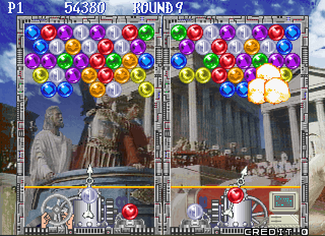 Bust-A-Move Again Arcade Screenshot: The player on the right blows up some bubbles...