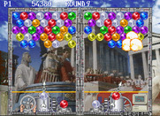 Bust-A-Move Again for Arcade - The player on the right blows up some bubbles...