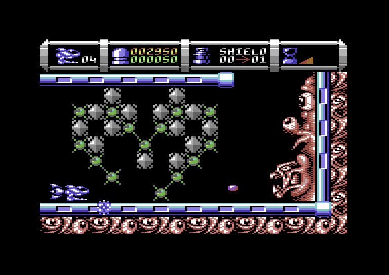 Cybernoid II: The Revenge Commodore 64 Screenshot: You can shoot these blocks to clear a passageway.