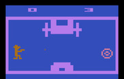 Outlaw for Atari 2600 - Try to shoot the moving target with a moving stagecoach in the way.