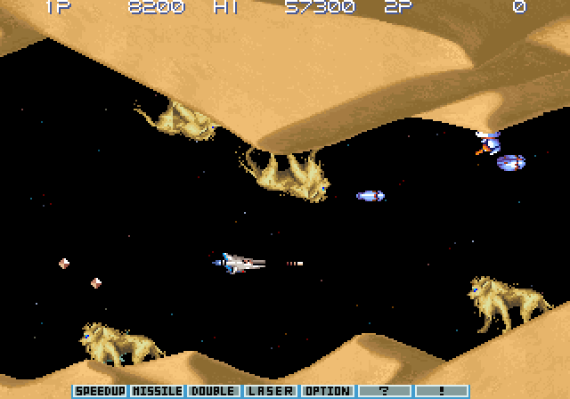 Gradius III Arcade Screenshot: Starting out in a sandy region.