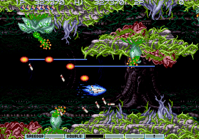 Gradius III Arcade Screenshot: Entering the difficult jungle zone...