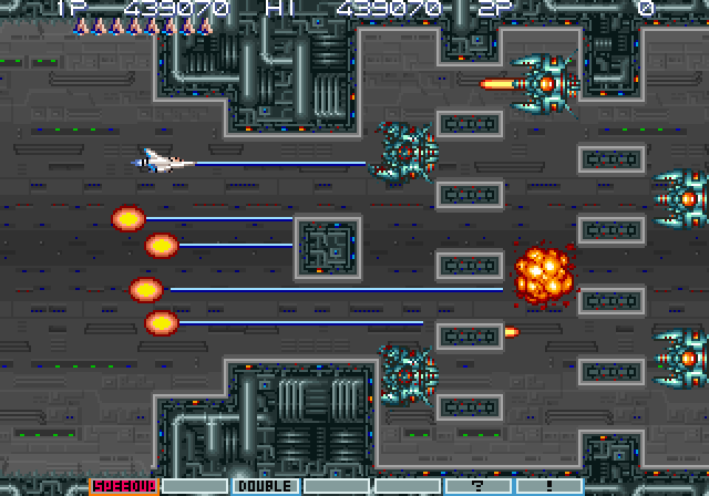 Gradius III Arcade Screenshot: This maze of enemy ships is tough...