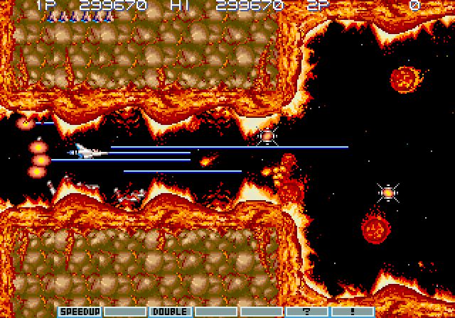 Gradius III Arcade Screenshot: Fighting my way through a narrow path...