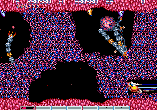 Gradius III Arcade Screenshot: Blast your way through a solid wall that also regenerates!