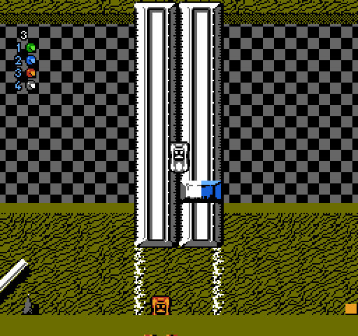 Micro Machines NES / Famicom Screenshot: A couple of rulers make a bridge from one desk to the next...