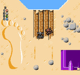 Micro Machines for NES / Famicom - Use the ramp to jump over the water...