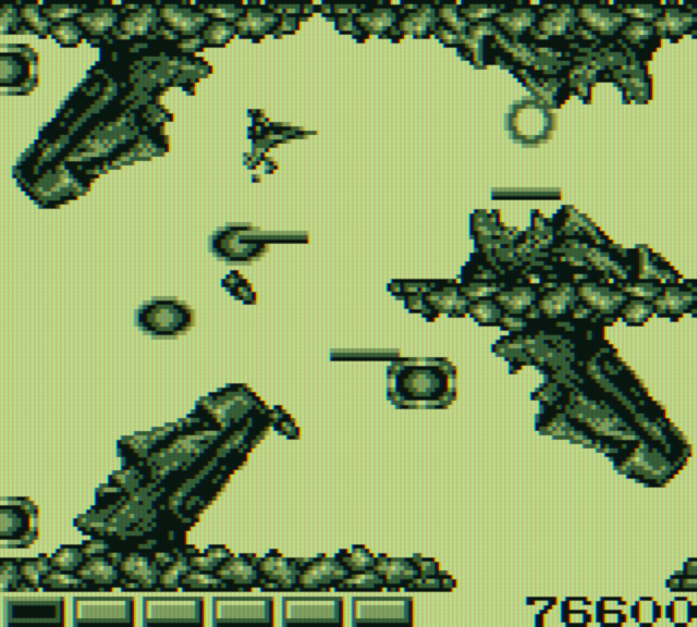 Nemesis Game Boy Screenshot: You can destroy the Moai, but only when their mouth is open.
