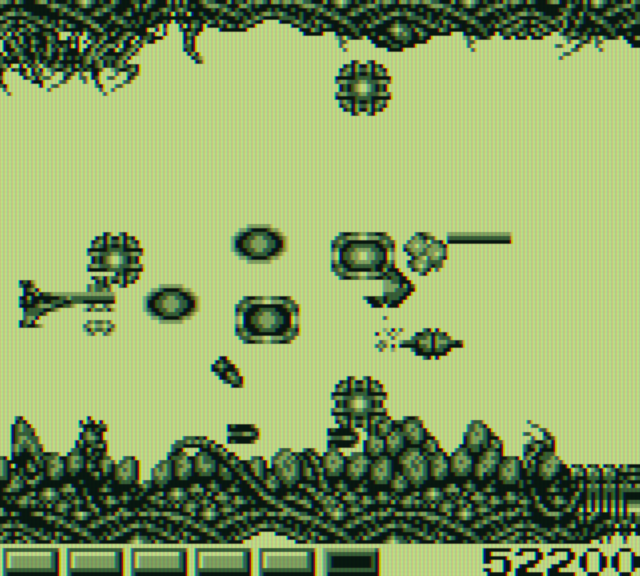 Nemesis Game Boy Screenshot: Some enemies leave behind bonus items when destroyed...