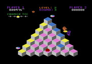 Q*bert for Atari 8-bit - Jump on the discs to evade the snake.