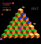 Q*bert for Arcade - All enemies pause temporarily if you catch the green ball.