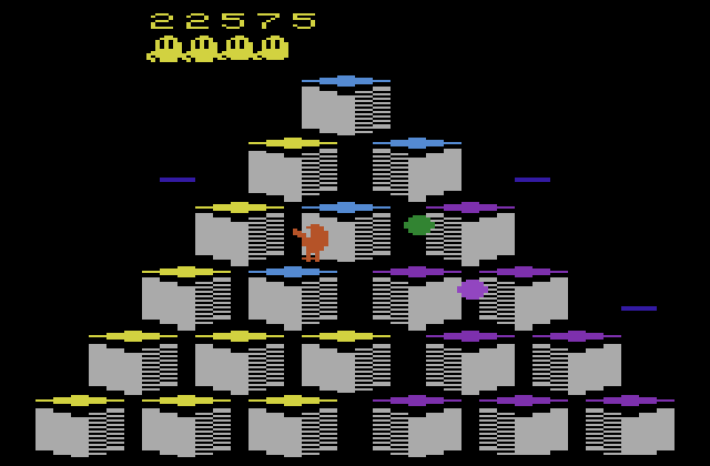 Q*bert Atari 2600 Screenshot: Catch the green ball to temporarily freeze opponents.