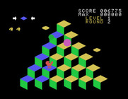 Q*bert for Sega SG-1000 - Catch the green ball to temporarily freeze enemies.