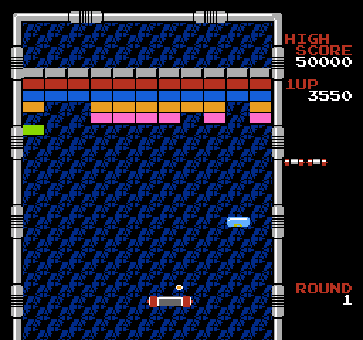 Arkanoid NES / Famicom Screenshot: Collect the light blue capsule to split the ball into three.