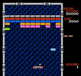 Arkanoid for NES / Famicom - Collect the light blue capsule to split the ball into three.