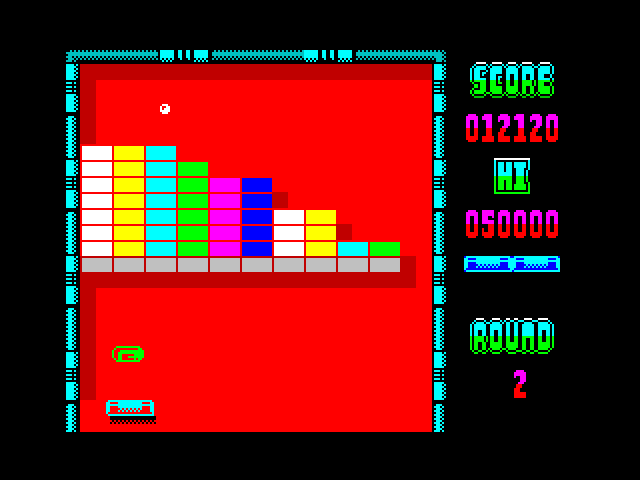 Arkanoid ZX Spectrum Screenshot: The green capsule will allow the paddle to catch the ball.