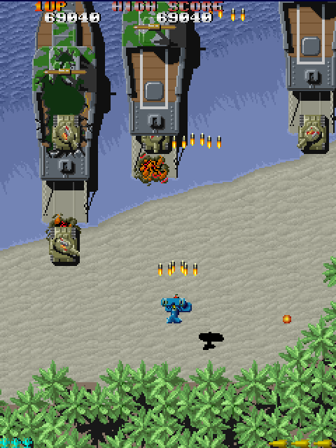 Sky Shark Arcade Screenshot: Tanks appear from these ships...