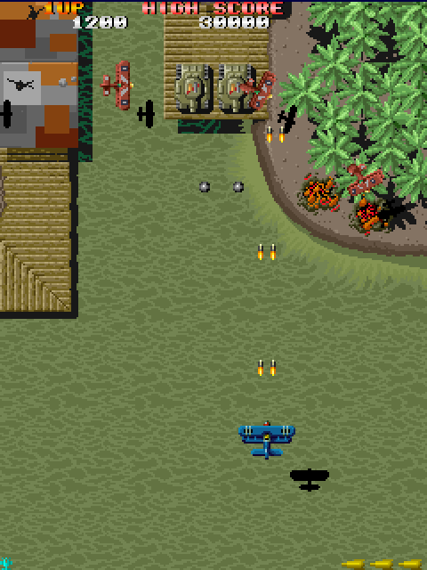 Sky Shark Arcade Screenshot: Shooting at some planes and tanks...