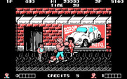 Double Dragon for IBM PC/Compatibles - A large opponent punches...