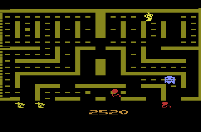 Jr. Pac-Man Atari 2600 Screenshot: The red balloon turns dots into a larger size; worth more points, but slows down Pac-Mans movement.