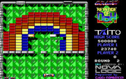 Arkanoid 2: Revenge of DOH for IBM PC/Compatibles - Destroying bricks on a rainbow shaped round.