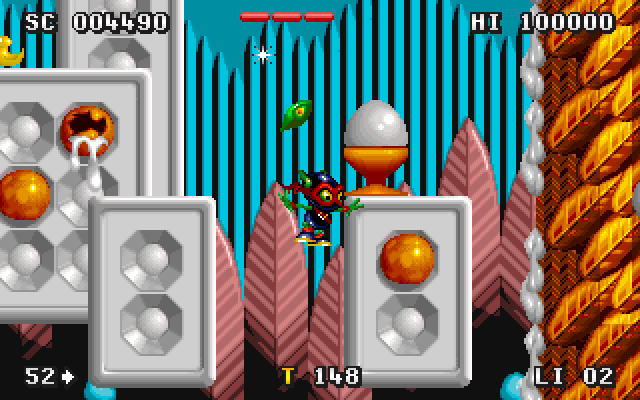 Zool 2 IBM PC/Compatibles Screenshot: Attempting to jump up to a new platform...