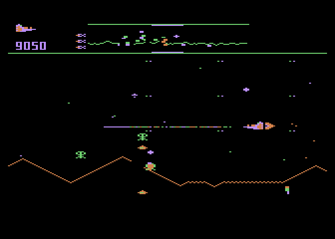 Defender Atari 5200 Screenshot: The green landers attempt to capture humans in the city.