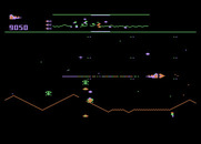 Defender for Atari 5200 - The green landers attempt to capture humans in the city.